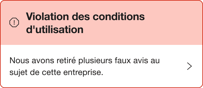 A Red warning alert banner that says "Breach of guidelines. We've removed a number of fake reviews for this company."